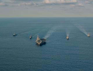US Navy, Japan Maritime Self-Defense Force and Republic of Korea Navy ships sail together during a trilateral maritime exercise, 26 November 2023 