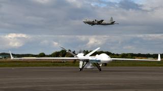 Japan Coast Guard Unmanned Aerial Vehicle SeaGuardian and JMSDF P-3C at Hachinohe Air Base