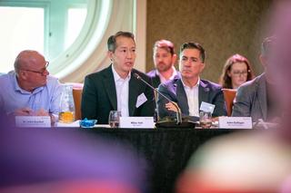 Person speaking at roundtable event