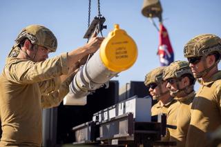 An Australian Army Gunner helps guide an AIM-120 missile onto a National Advanced Surface to Air Missile System during Exercise Talisman Sabre 2025.