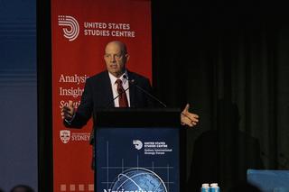 General Berger speaking on stage at the conference lectern.