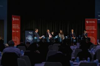 The five panellists speaking on stage at the conference.