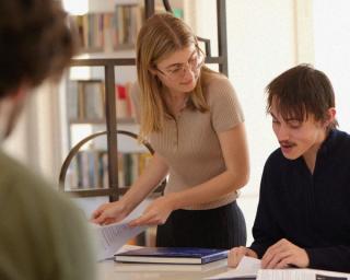 Staff and student interns talking at the USSC's office.