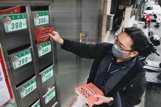A person putting brochures in letter boxes.